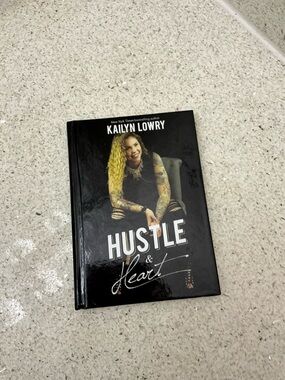 Hustler Hollywood Black Hardcover Book with White Title Text